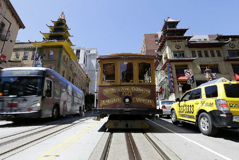 A San Francisco cable car sits idle Friday during a power failure caused by a fire at a substation. Some regulated utilities are spending more money on improvements to their distribution grids, a move designed to generate revenue as electricity demand remains flat nationwide.  
