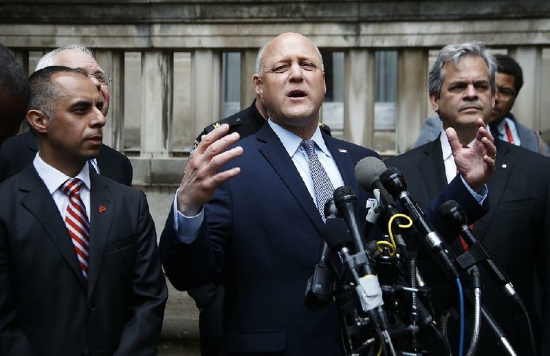 New Orleans Mayor Mitch Landrieu, flanked by counterparts Jorge Elorza (left) of Providence, R.I., and Steve Adler of Austin, Texas, speaks Tuesday outside the Justice Department in Washington after a meeting with Attorney General Jeff Sessions.