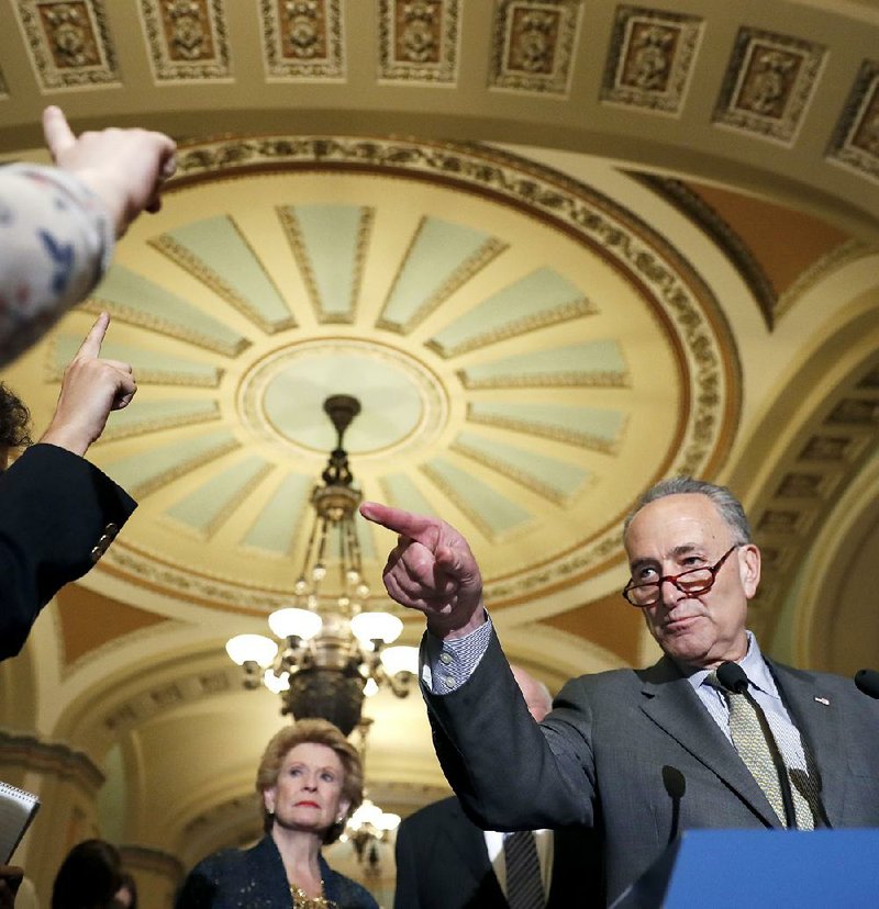 Senate Minority Leader Charles Schumer said Tuesday that GOP negotiators were following President Donald Trump’s lead in not demanding border-wall funds in the spending bill.