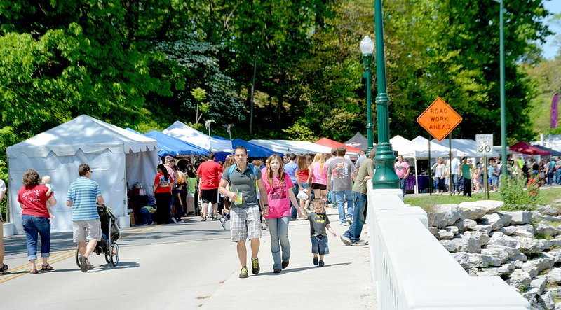 File Photo Dogwood Festival craft vendor booths will be extended along both sides of Sager Creek this year, including in front of the Masonic Lodge.