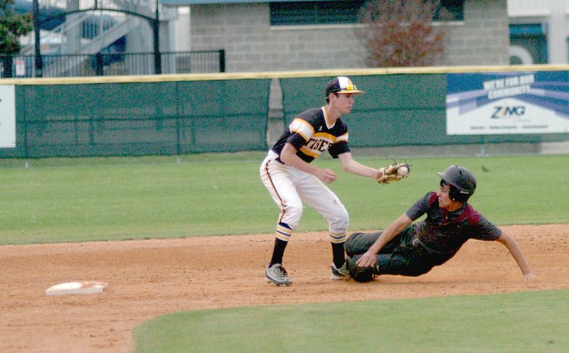 MARK HUMPHREY ENTERPRISE-LEADER Gentry&#8217;s Carlos Alvarez Del Castillo attempts to slide under the tag of Prairie Grove second baseman Silas Myane coming into second. Gentry lost to Prairie Grove, 10-2, on April 13.