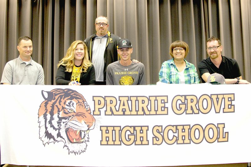 Photo by Shelley Williams special to the Enterprise-Leader Prairie Grove senior Austin Jentzsch recently signed to play baseball with Northeastern State University in Tahlequah, Okla. accompanied by his family. Picture (from left) Shane Jentzsch, Austin&#8217;s father, Karyn Jentzsch, Austin&#8217;s step mother, Prairie Grove baseball coach Chris Mileham, Austin Jentzsch, Gena Knight, Austin&#8217;s mother, and Kevin Knight, Austin&#8217;s step father. Through 21 games played this season, Jentzsch is batting .302 with 17 RBIs, 8 doubles, 1 triple and 2 home-runs.