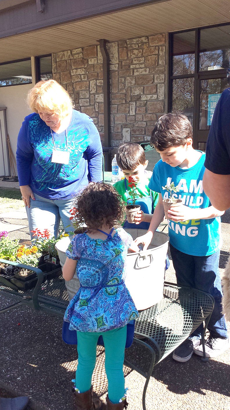 Photo submitted Everyone had such a great time planting flowers with Miss Myra at Silly Songs and Stories at the Bella Vista Public Library.
