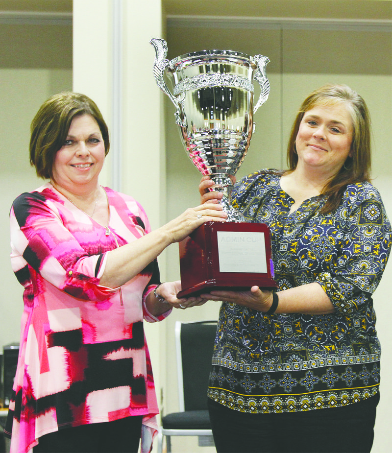 Administrative Professional: Cindy Grimmett, left, presents Denise Matthews, right, with the 2017 Administrative Professional of the Year Award during the El Dorado-Union County Chamber of Commerce's 2017 Administrative Professionals Appreciation Luncheon at the El Dorado Conference Center.