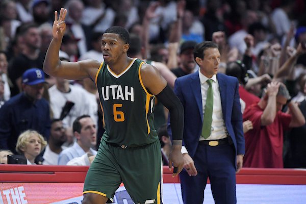 Utah Jazz forward Joe Johnson, left, celebrates after making a 3-point shot as coach Quin Snyder stands nearby during the second half in Game 5 of the team'sp NBA basketball first-round playoff series against the Los Angeles Clippers, Tuesday, April 25, 2017, in Los Angeles. The Jazz won 96-92. (AP Photo/Mark J. Terrill)