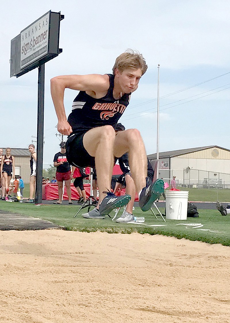 Alex Fink of Gravette competes in the long jump at the district track meet in Pea Ridge on April 25. Fink took second in the event and was the high-point athlete in the meet.