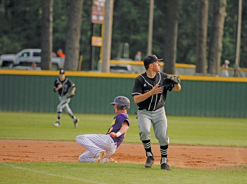 News-Times/Terrance Armstard Junction City's Joe Lowe slides into third base as Smackover third baseman Nick Impson awaits the throw during their contest at Junction City earlier this season. The 8-3A District Tournament gets underway today in Smackover with two quarterfinal games. The Dragons and Bucks, who shared the conference title, will make their postseason debuts on Friday in the semifinals. The Dragons enter the tournament as the top seed, while the Bucks are seeded second.