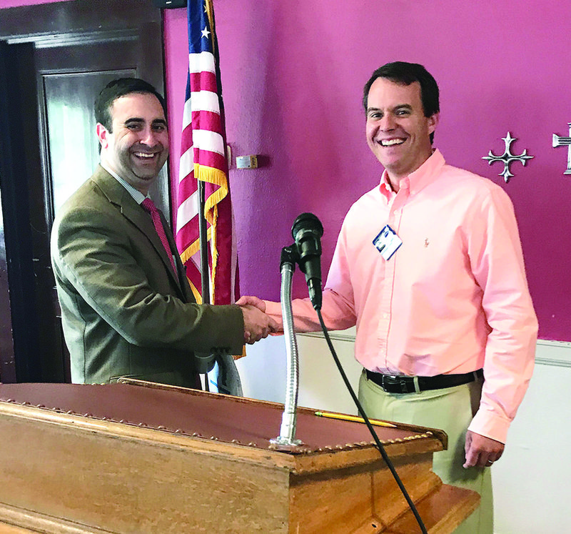 Guest Speaker: Chief Operating Officer of Medical Center of South Arkansas, Ross Korkmas, shakes hands with Kiwanis President, Jeffrey Sawyer. Korkmas was the guest speaker at last week's Kiwanis Club meeting where he shared information on MCSA. 