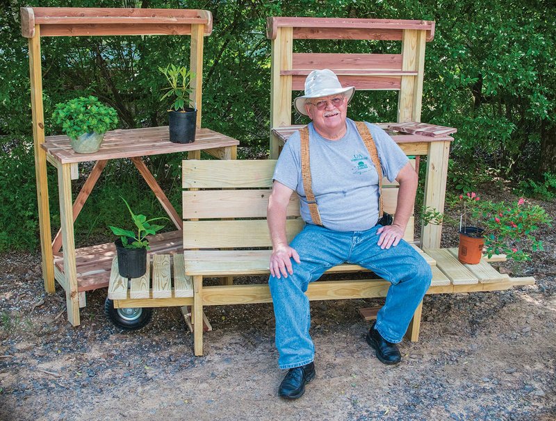 Frank Russenberger, a past president of the Pope County Master Gardeners, is ready for the group’s annual plant sale, set for May 6 at the Pope County Fairgrounds. He has donated these handcrafted potting tables and wheelbarrow bench to the plant sale. Proceeds from the sale of these specialty items, as well as from the sale of plants, will help fund the Master Gardeners’ beautification and education projects in Pope County.