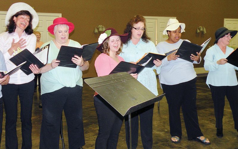Members of the Conway Women’s Chorus’ World War I Ensemble sing “Oh Johnny, Oh Johnny, Oh!” during a preview of their Sunday concert. Vocalists include, from left, Melissa Stiller, Julie Crain, Mimi Carlin, Lisa Bouabedi, Kendra Thomas and Teena Woodworth.