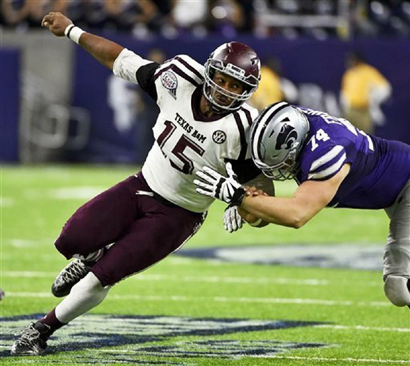 Defensive end Myles Garrett (left), of Texas A&M, who had 8½ sacks last season, is the odds-on-favorite to be selected by Cleveland with the No. 1 pick in the first round of today’s NFL Draft.
