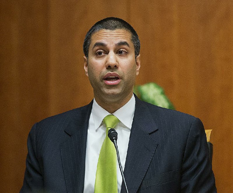 In this Feb. 26, 2015, file photo, Federal Communication Commission Chairman Ajit Pai speaks during an open hearing and vote on "Net Neutrality" in Washington. 