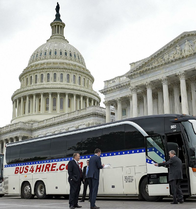 Republican and Democratic senators board a bus Wednesday on Capitol Hill for a ride to the White House, where President Donald Trump and other officials gave them a classified briefing on North Korea.