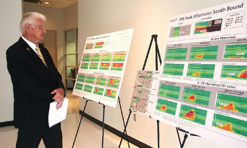 Ward Mayor Art Brooke looks over congestion charts for the downtown Little Rock/North Little Rock Interstate 30 corridor during a Metroplan meeting Wednesday in Little Rock. Ward is the northernmost city on Arkansas 67/167 in the Metroplan district.