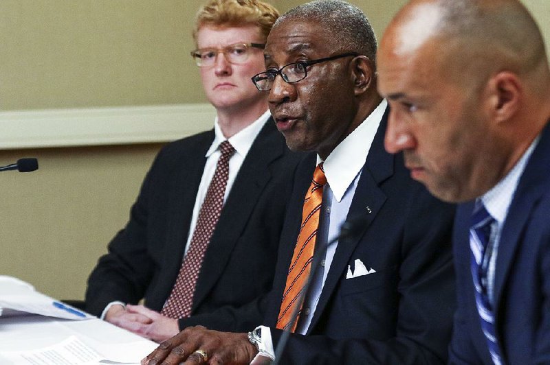 Flanked by his lawyers, Pulaski County Circuit Judge Wendell Griffen tells reporters at a Wednesday news conference at Little Rock’s Doubletree Hotel that he has filed an ethics complaint against Arkansas Supreme Court justices after they filed a complaint against him this month and removed him from handling any death penalty cases.
