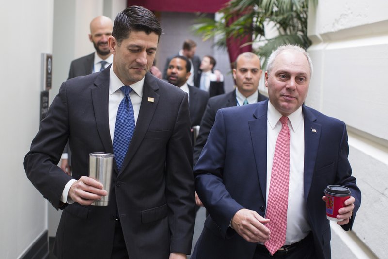 House Speaker Paul Ryan of Wis., left, talks with House Majority Whip Steve Scalise of La. as they arrive for a GOP caucus meeting on Capitol Hill in Washington, Wednesday, April 26, 2017. (AP Photo/Evan Vucci)
