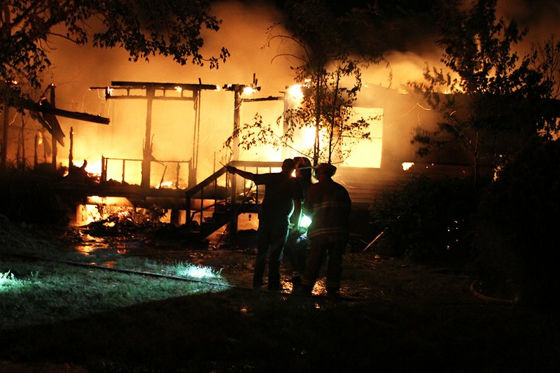 The Sentinel-Record/Grace Brown
Morning Star and Lake Hamilton fire departments responded to a fully involved fire at a residence at 100 Shannon Lane Wednesday night. One man was taken to a local hospital by LifeNet due to smoke inhalation.