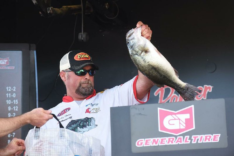 Charley Slaton of Valliant, Okla., leads the co-angler division after Thursday’s first round of the FLW Tournament on Beaver Lake. He caught 5 bass weighing 12 pounds, 2 ounces.