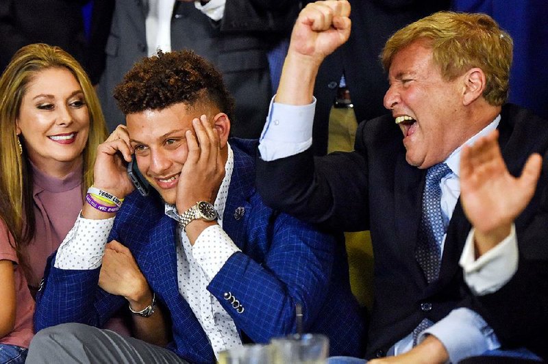 Former Texas Tech quarterback Patrick Mahomes (center), surrounded by family members, was taken by Kansas City with the No. 10 pick in the first round of the NFL Draft on Thursday.