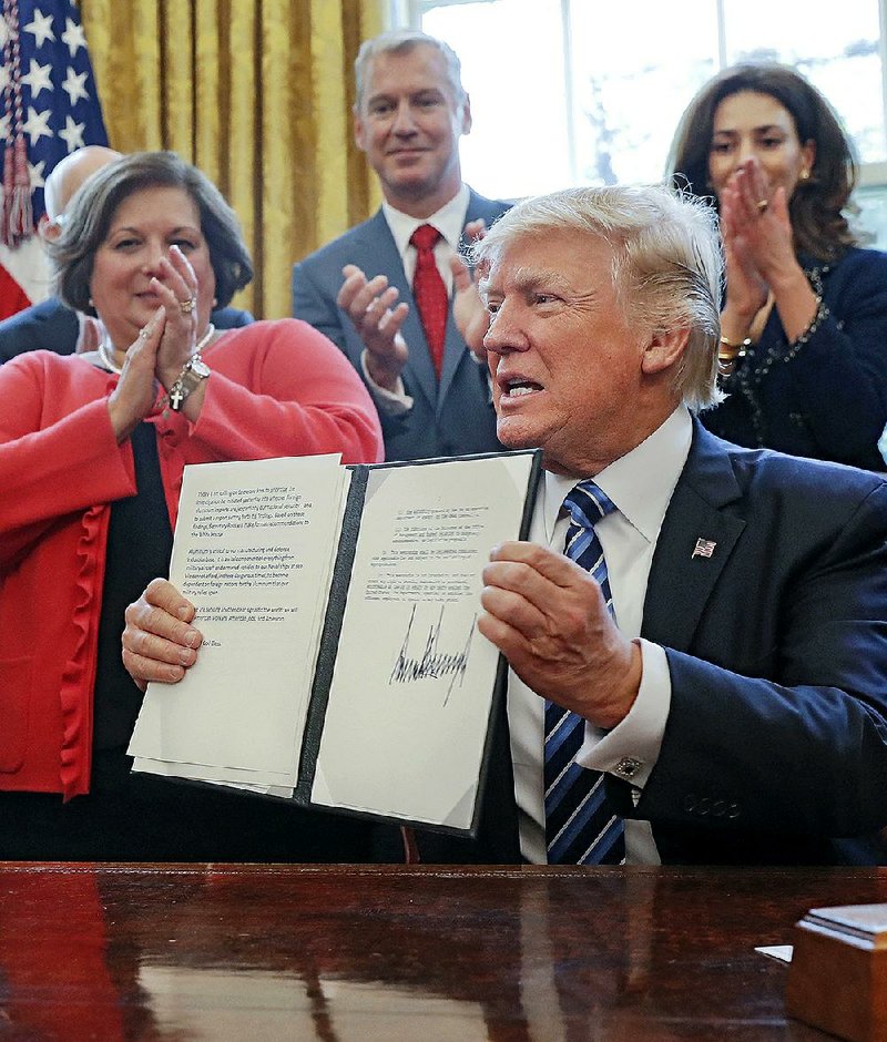 President Donald Trump on Thursday at the White House signed a memorandum directing his administration to expedite an investigation into whether aluminum imports are jeopardizing national security.