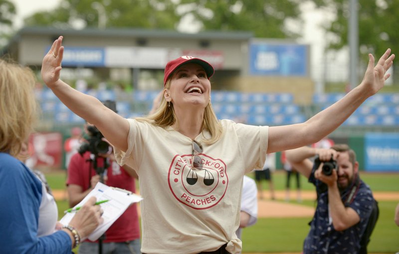 Geena Davis takes the field during player introductions at the second annual Bentonville Film Festival “A League of Their Own” reunion softball game. This year’s game will be played at 11 a.m. May 7 at Arvest Ballpark in Springdale.