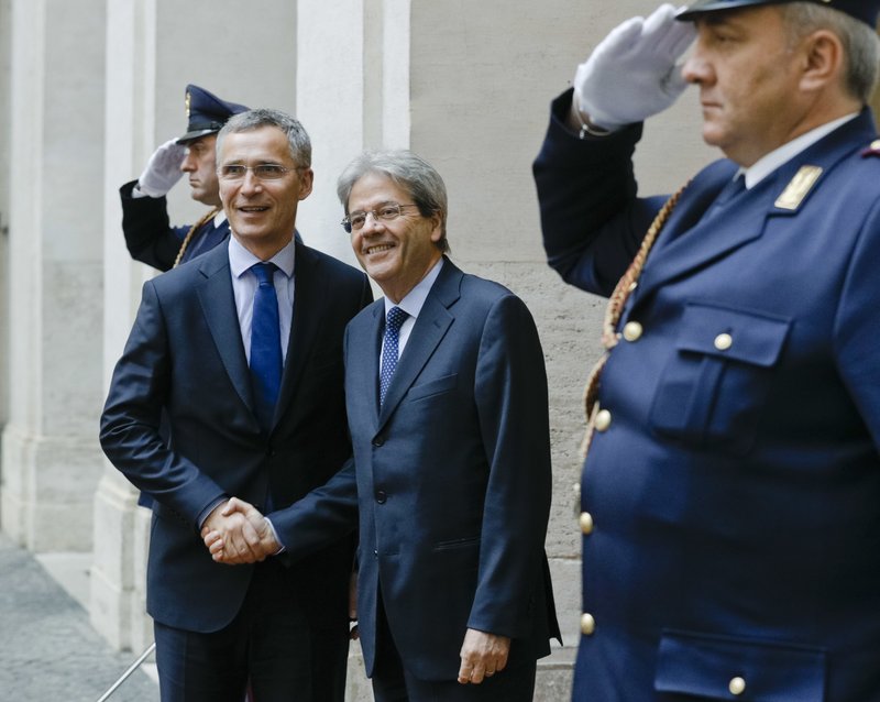 Italian Premier Paolo Gentiloni, right, shakes hands with NATO Secretary General, Jens Stoltenberg as they meet at the premier's office Chigi Palace in Rome for talks, Thursday, April 27, 2017. (AP Photo/Andrew Medichini)