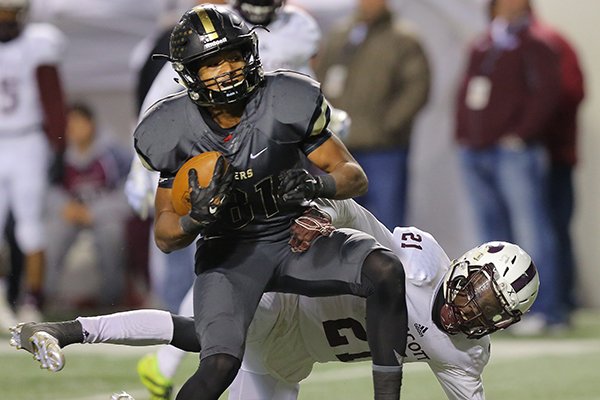 Charleston receiver Sean Michael Flanagan breaks away from Prescott defender Ja’mozyia Williamson (right) during the second half Saturday, Dec. 10, 2016, at War Memorial Stadium in Little Rock. Flanagan finished with 11 catches for 130 yards and 3 rushes for 51 yards and 1 touchdown in the Class 3A championship game.