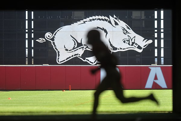 An Arkansas player runs during practice inside Walker Pavilion on Tuesday, April 5, 2016, in Fayetteville. 