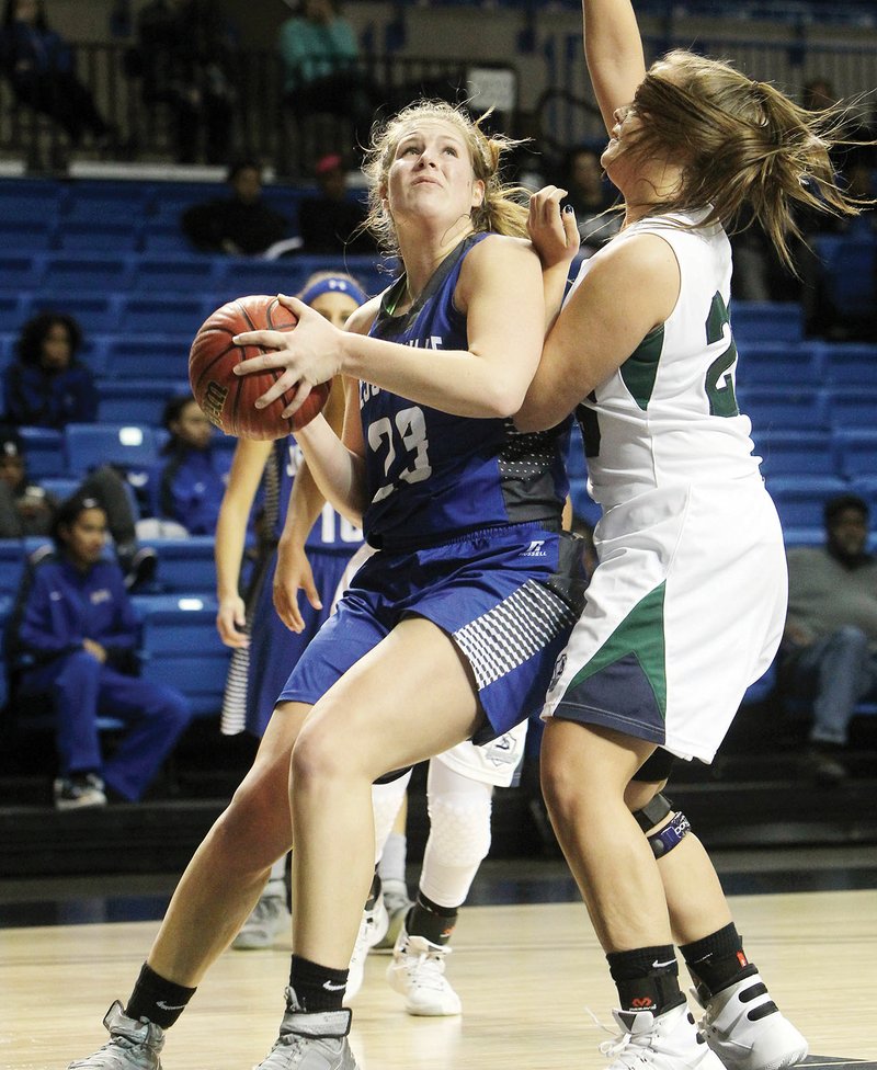 Jessieville’s Kellie Lampo, No. 23, goes up for a basket as Little Rock Christian’s Claire Newton defends during the Spa City Shootout on Dec. 28 at Bank of the Ozarks Arena.