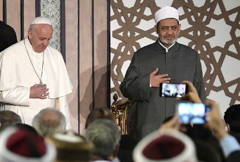 Pope Francis stands with Sheikh Ahmed el-Tayeb at Cairo’s Al-Azhar university on Friday as Francis opened a two-day visit to Egypt. The pope urged Egypt’s imams to teach and preach tolerance and peace.