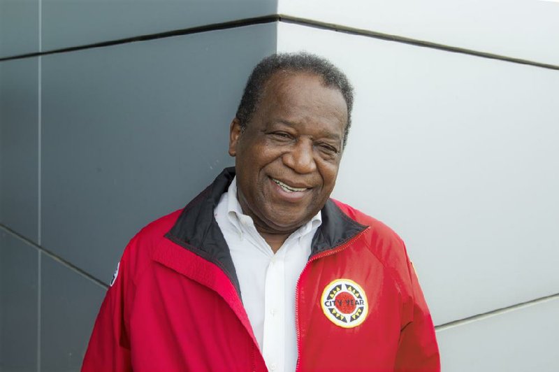 Bob Nash sports the signature, eye-catching City Year red jacket with pride. He credits an organization similar to City Year for his rise from a poor student to a White House adviser. “These young people are going to be leading the state one day.” 