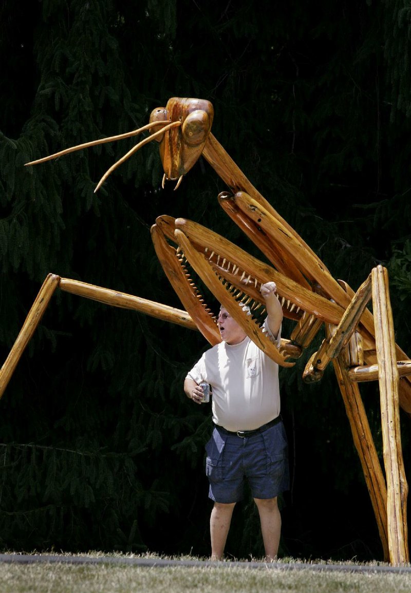 James Parmiter is trapped by a giant mantis at the Clinton Presidential Center. The warning signs are there for a reason.Fayetteville-born Otus the Head Cat’s award-winning column of humorous fabrication appears every Saturday.
