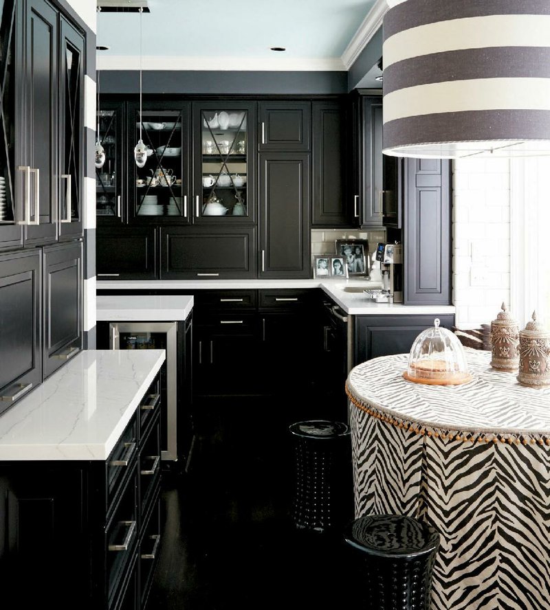 Transitional black-and-white kitchens are rising in popularity. Omega’s Clio door style in a black opaque finish pairs here with Cambria’s Ella quartz countertops to reflect a look that is fresh yet timeless.