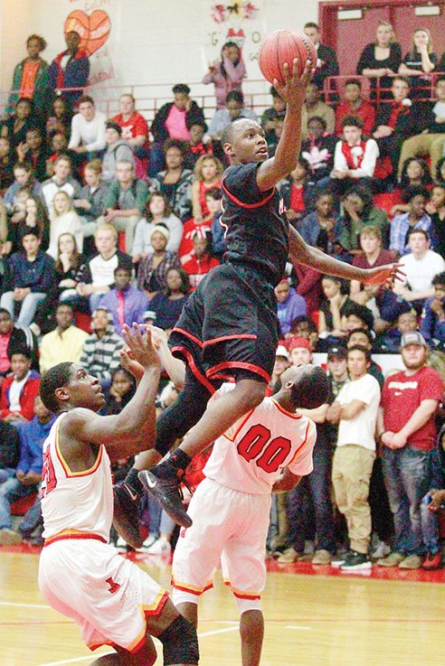 Maumelle guard Tremont Robinson skies toward the basket during the Hornets’ win at Jacksonville this season. Robinson is the 2016-17 River Valley & Ozark Edition Boys Basketball Player of the Year.