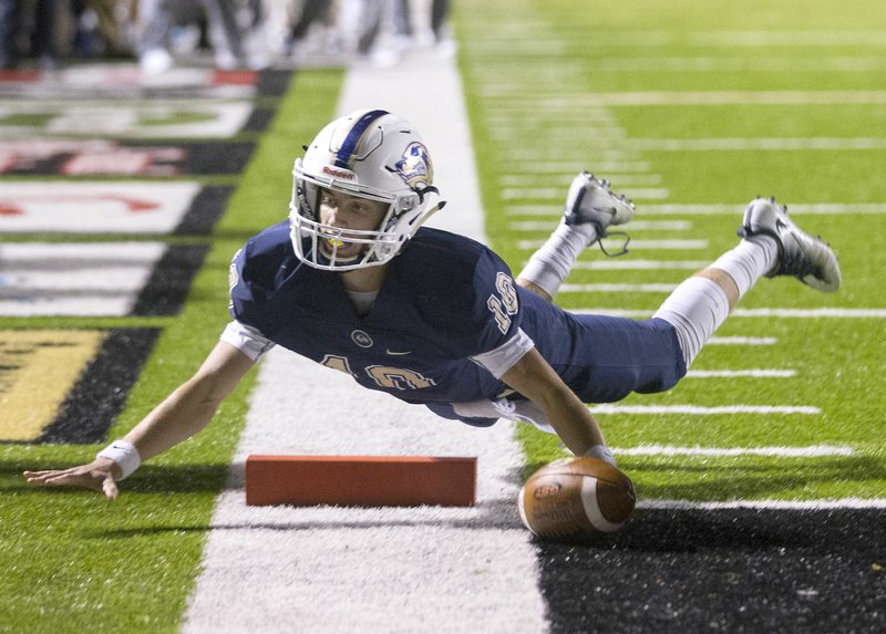 Bentonville West quarterback Will Jarrett dives into the end zone for a score on Nov. 10, 2016, during the Wolverines’ first-round playoff game against Cabot at the Tiger Athletic Complex in Bentonville. Jarrett, the All-NWADG Division I Newcomer of the Year last season, returns to lead the Wolverines in their second season.