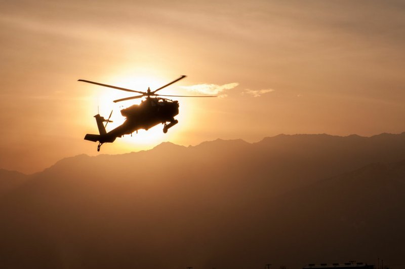 An Army Apache helicopter flies over Afghanistan.The Army has launched an investigation into the deaths of two elite Army Rangers in Afghanistan early Thursday, saying they may have been killed in a friendly-fire incident. 