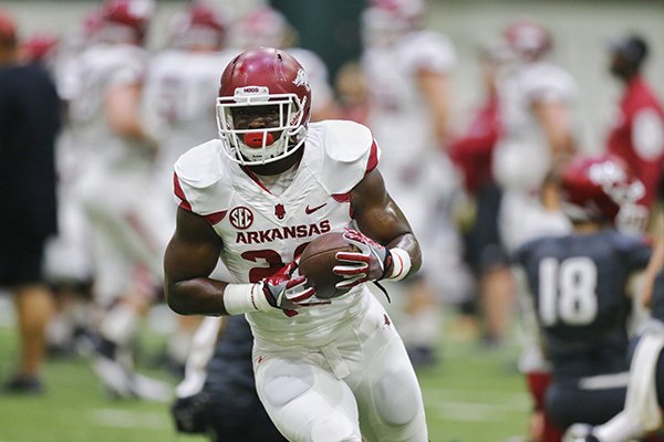 Arkansas running back Rawleigh Williams goes through practice Saturday, April 29, 2017, in Fayetteville. 