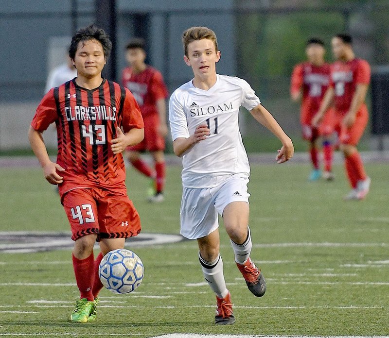 Bud Sullins/Special to Siloam Sunday Siloam Springs sophomore Eli Jackson runs to the ball Thursday night versus Clarksville. Jackson and Jack Bos scored goals in the second half as Siloam Springs defeated Clarksville 2-1.