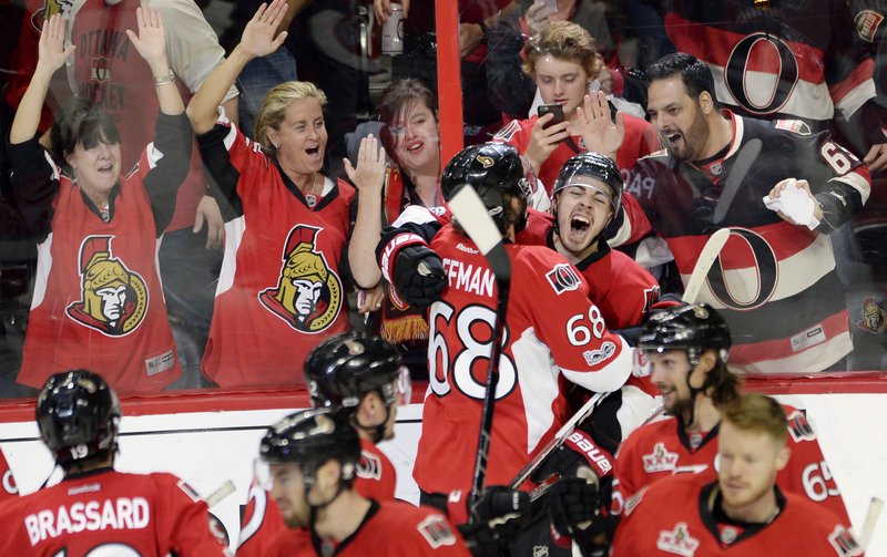 Ottawa Senators center Jean-Gabriel Pageau (44) celebrates his game-winning goal with left wing Mike Hoffman (68) during the second overtime of Game 2 against the New York Rangers in an NHL hockey Stanley Cup second-round playoff series Saturday, April 29, 2017, in Ottawa, Ontario. The Senators won 6-5. (Adrian Wyld/The Canadian Press via AP)