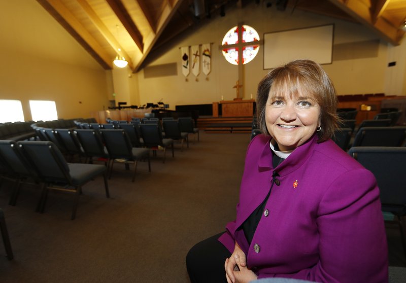 This Wednesday, April 19, 2017 photo shows Bishop Karen Oliveto in the sanctuary of a United Methodist Church near her office in Highlands Ranch, Colo. 