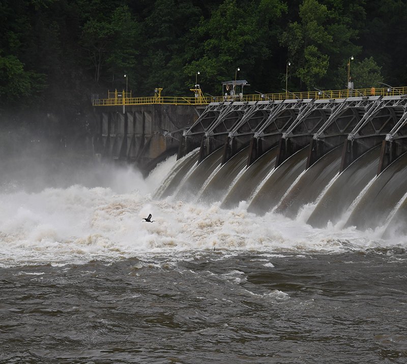 The Sentinel-Record/Mara Kuhn ALL GATES OPEN: Around 45,000 cubic feet per second of water rushes from Remmel Dam on Sunday morning following heavy rains overnight.