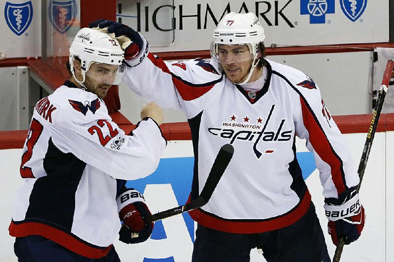 Washington defenseman Kevin Shattenkirk (left) helped the Capitals cut their NHL Eastern Conference semifi nal series deficit in half by scoring the game-winning goal in their 3-2, overtime victory over Pittsburgh on Monday. The Penguins now lead the series 2-1 with Game 4 set for Wednesday.