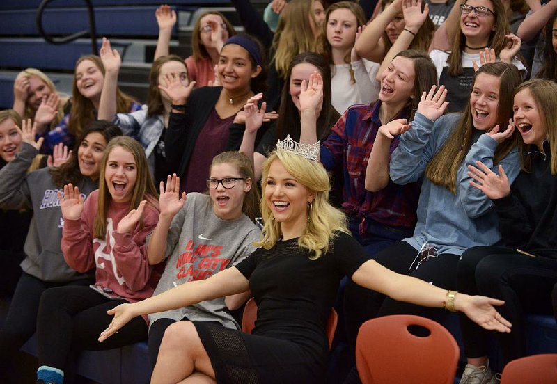 Miss America Savvy Shields of Fayetteville poses for photos with students Monday during a presentation with Gov. Asa Hutchinson at Fulbright Junior High in Bentonville to kick off a new initiative called “Healthy Active Arkansas.”