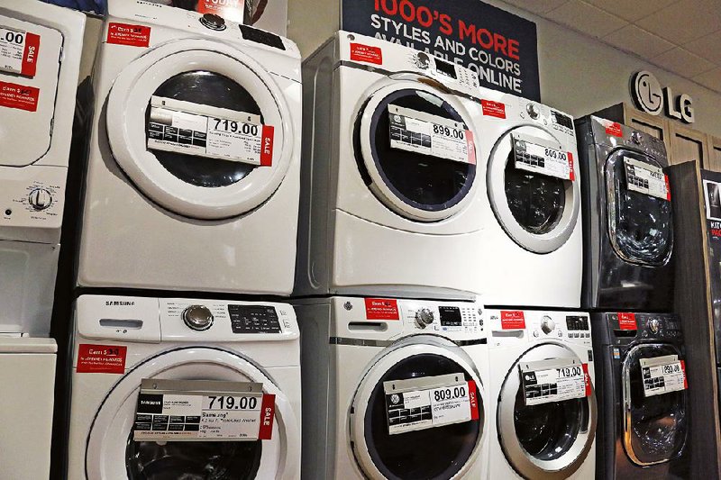 Washers and dryers are displayed at a J.C. Penney store in Pittsburgh in this February file photo. Consumer spending was unchanged in March after also being flat in February, the Commerce Department said Monday.
