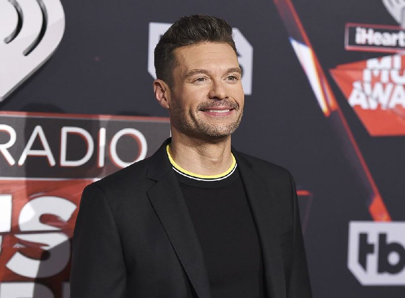 In this Sunday, March 5, 2017, file photo, Ryan Seacrest arrives at the iHeartRadio Music Awards at the Forum in Inglewood, Calif. 