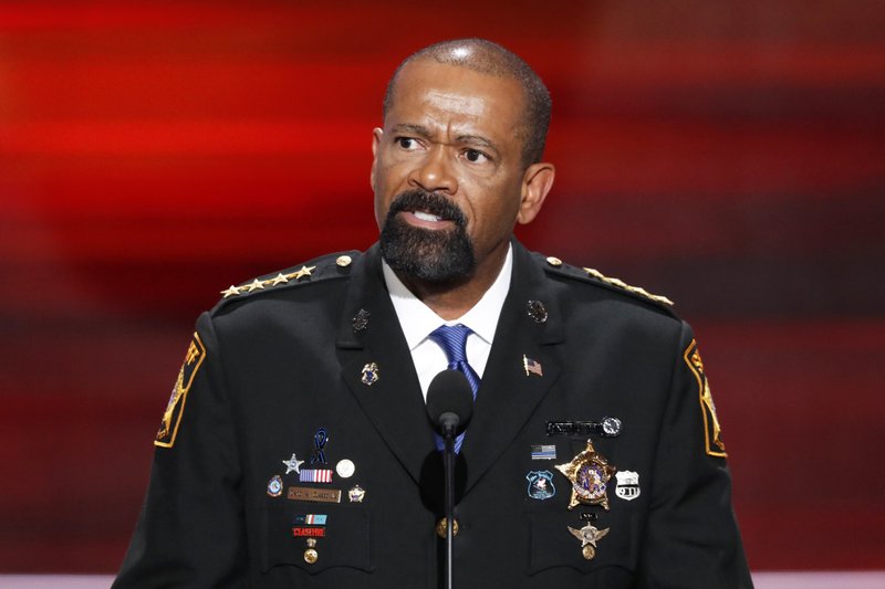 FILE- In this July 18, 2016, file photo, David Clarke, Sheriff of Milwaukee County, Wis., speaks during the opening day of the Republican National Convention in Cleveland. A jury on Monday, May 1, 2017, recommended criminal charges against seven Milwaukee County jail staffers in the dehydration death of an inmate who went without water for seven days. The jail is overseen by Clarke, but the inquest did not target him. 