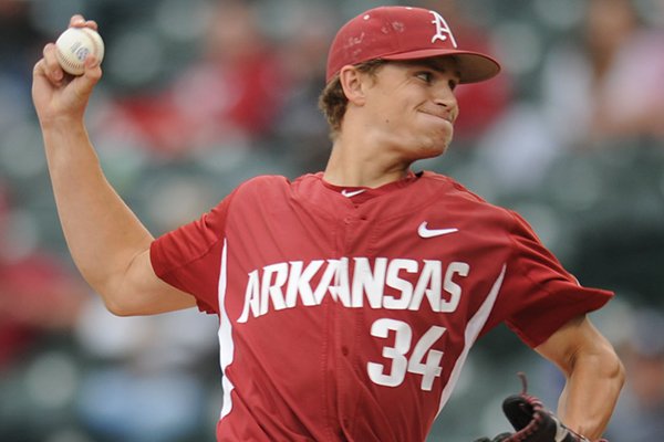 Arkansas reliever Jake Reindl delivers to the plate against Ole Miss Friday, April 28, 2017, during the seventh inning at Baum Stadium in Fayetteville. 
