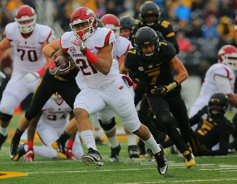 11/25/16
Arkansas Democrat-Gazette/STEPHEN B. THORNTON
Arkansas' Devwah Whaley gains big yardage against Missouri's during the first quarter of their game Friday in Columbia, Mo.
