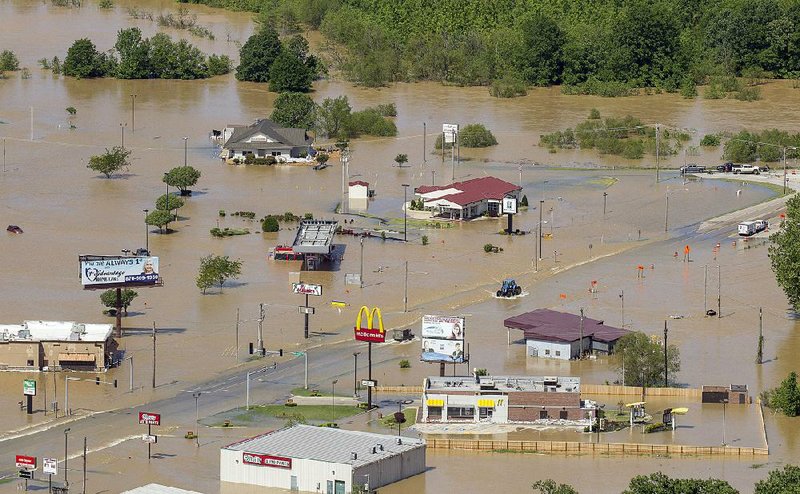 An aerial view shows the flooding Tuesday morning along U.S. 67 in Pocahontas as the Black River tops the levee system. City officials have ordered an evacuation of eastern Pocahontas and have closed a section of U.S. 62 east of town toward Corning.