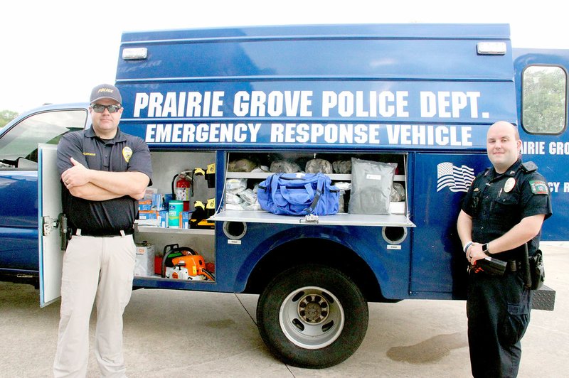 LYNN KUTTER ENTERPRISE-LEADER Prairie Grove Police Chief Chris Workman, left, and Sgt. Tim Standifer stand in front of the department&#8217;s new emergency response vehicle.